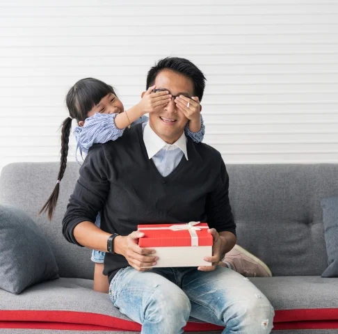 daughter surprising father with present