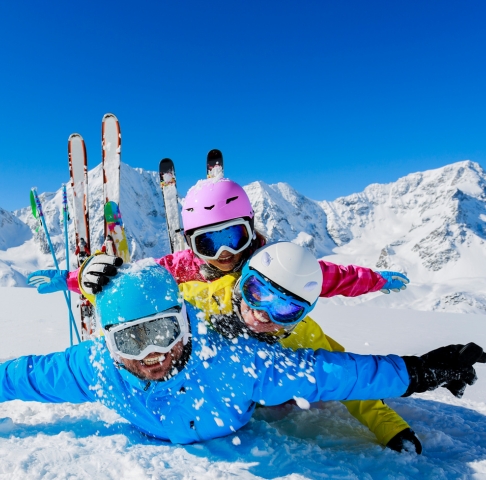 Image of young family on skiing holiday